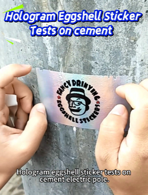 Hologram eggshell sticker tests on cement electric pole #eggshellstickers #eggshellstickersemily